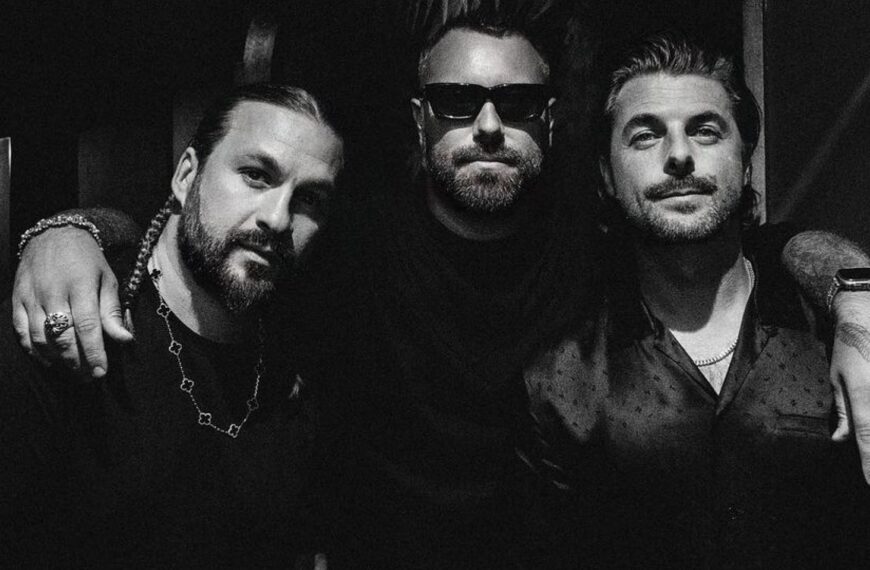 a group of men posing for a photo